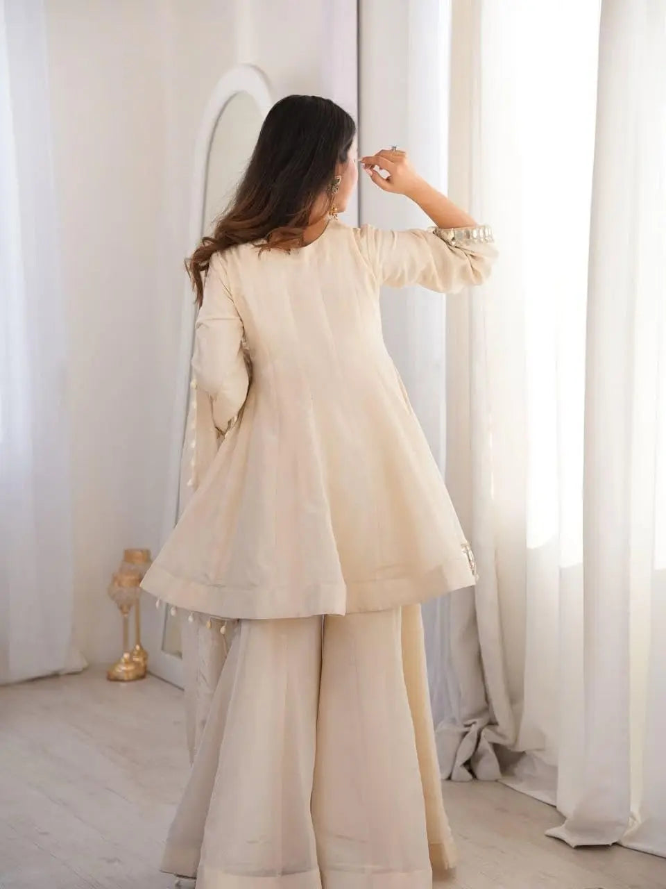 Women's Off-White Silk Blend Sharara Suit Set – Short Peplum Kurta with Heavy Mirror Work V-Neck & Shell Tassels – Designer Ethnic with Dupatta – Cream/Ivory Desi Diva
